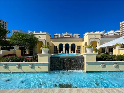 a view of yard with swimming pool outdoor seating and green space
