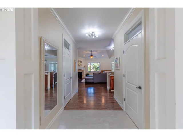a view of a hallway with living room and furniture