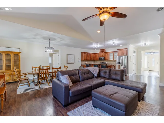 a living room with furniture and a chandelier