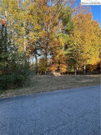 a view of dirt yard with a houses
