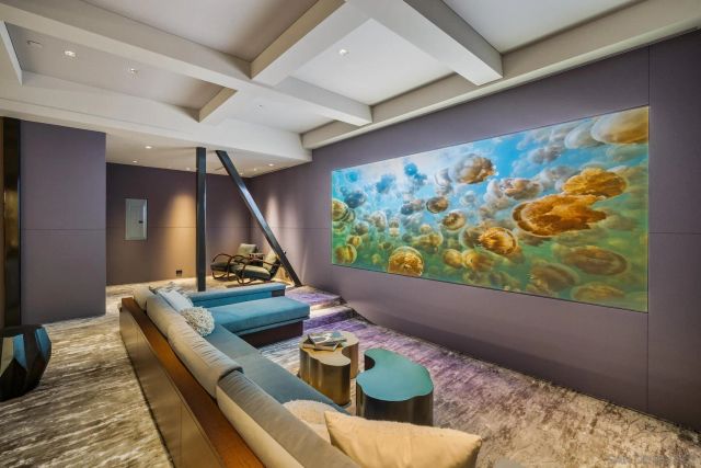 a bedroom with a large window and a bed