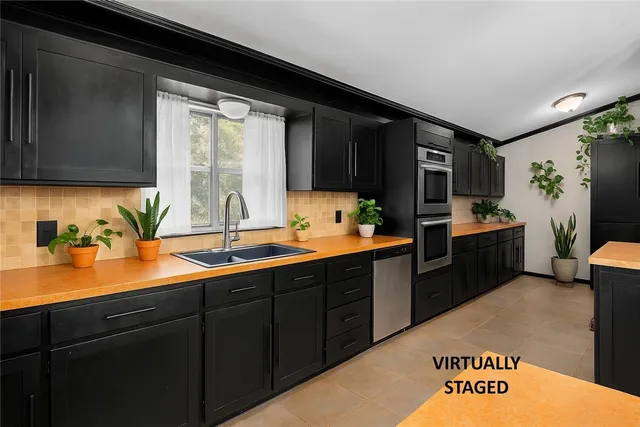a kitchen with a sink and cabinets