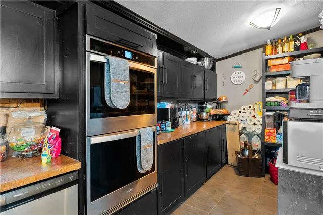 a kitchen with lots of counter top space and cabinets