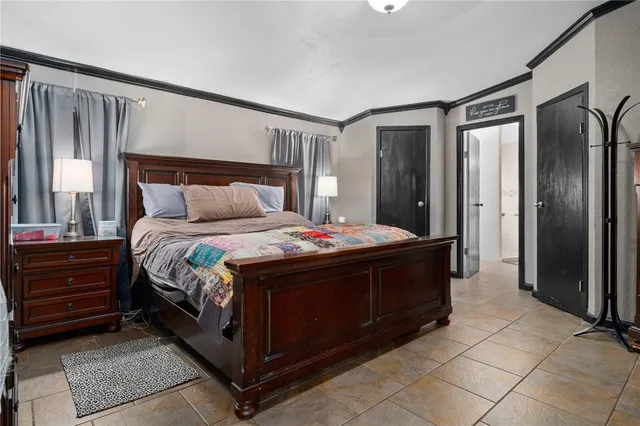 a bedroom with a bed and a dresser