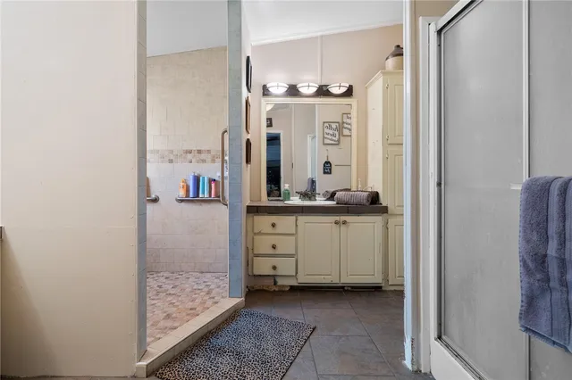 a bathroom with a mirror and a sink