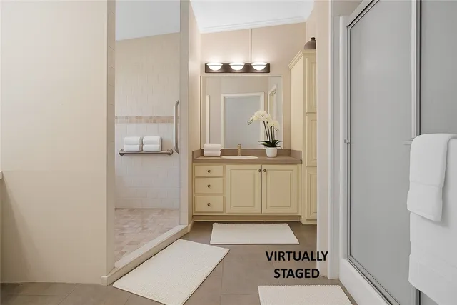 a view of a bathroom with a sink and a mirror