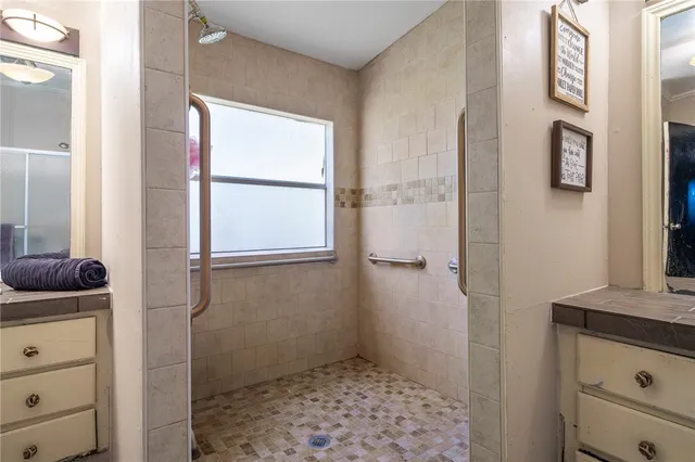a bathroom with a shower and a sink