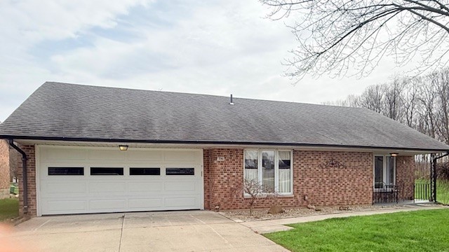 3361 Turner Drive Springfield, OH 45504 - Photo 3 of 18 This brick ranch offers a practical and comfortable living space with an attached garage.