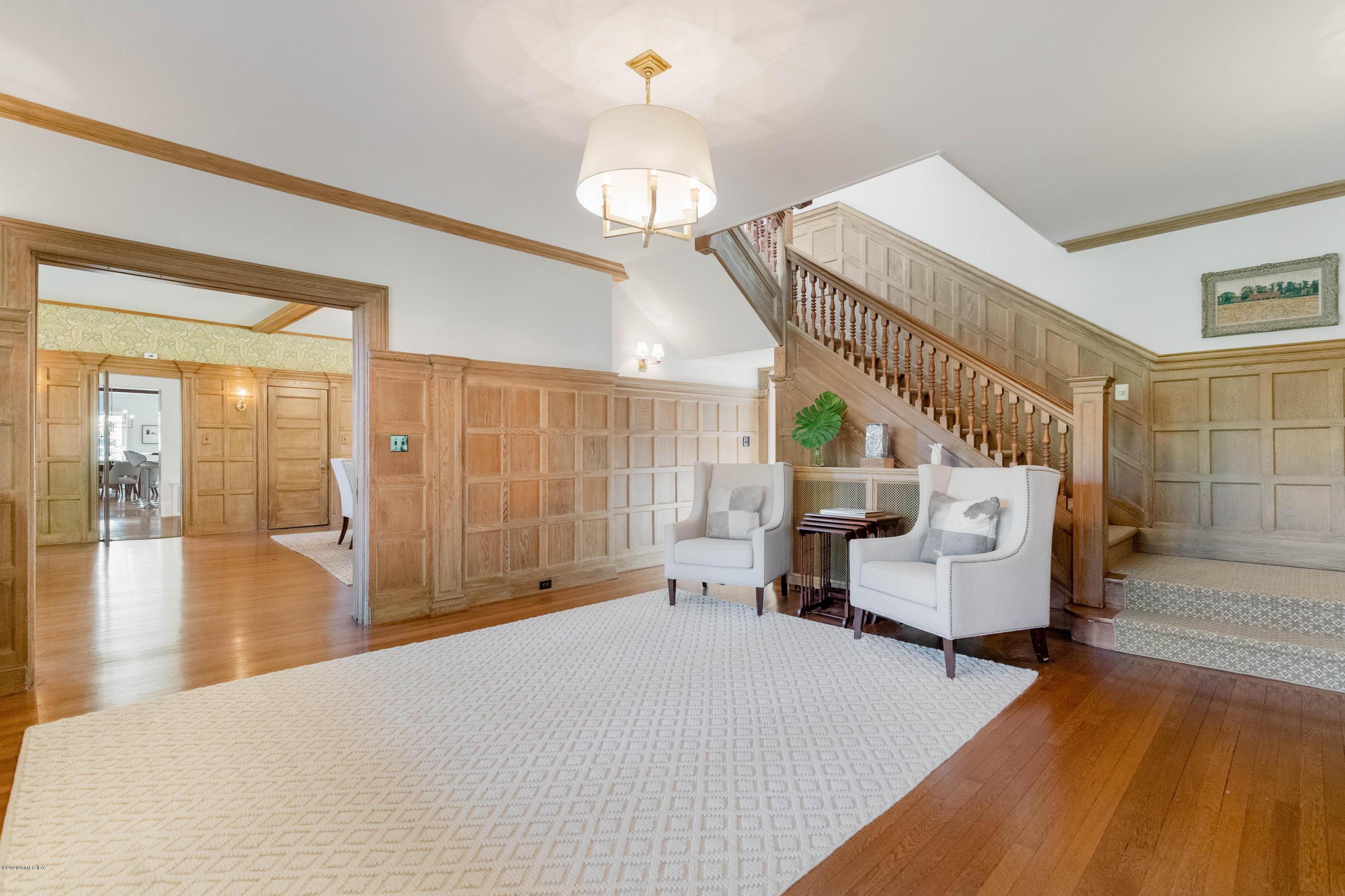 7 Brookside Park Greenwich, CT 06831 - Photo 11 of 52 a bedroom with furniture and a chandelier