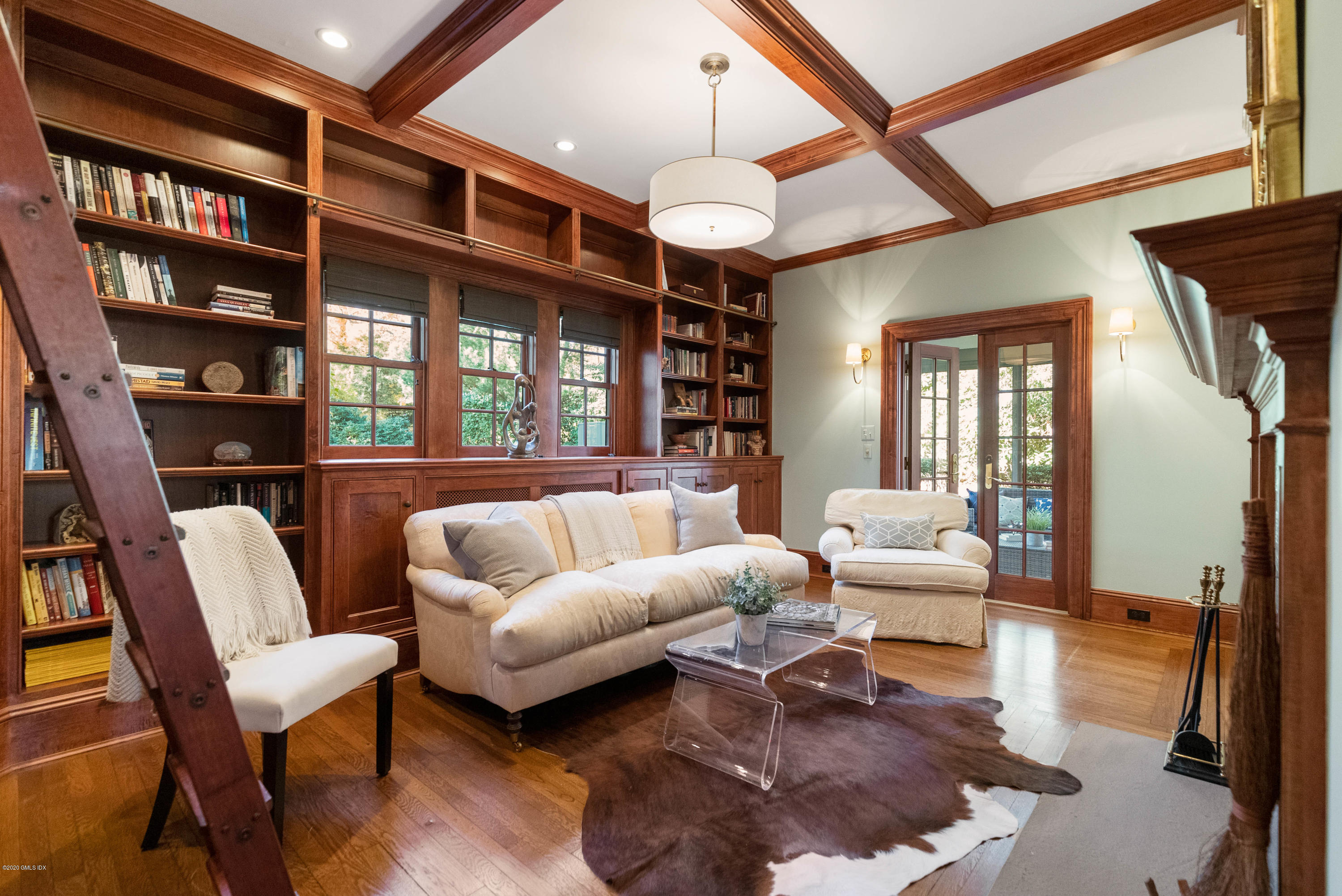 7 Brookside Park Greenwich, CT 06831 - Photo 15 of 52 a living room with furniture a rug and a large window