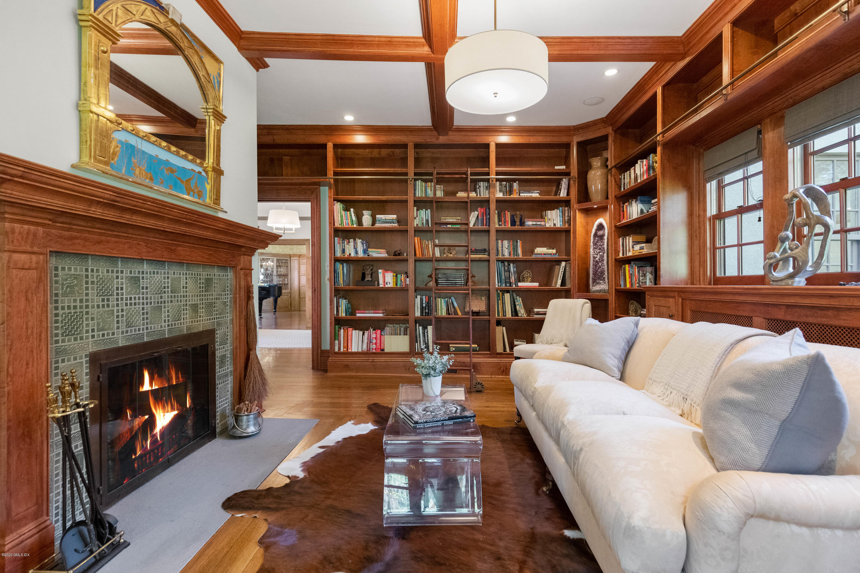 7 Brookside Park Greenwich, CT 06831 - Photo 16 of 52 a living room with furniture a fireplace and a large window