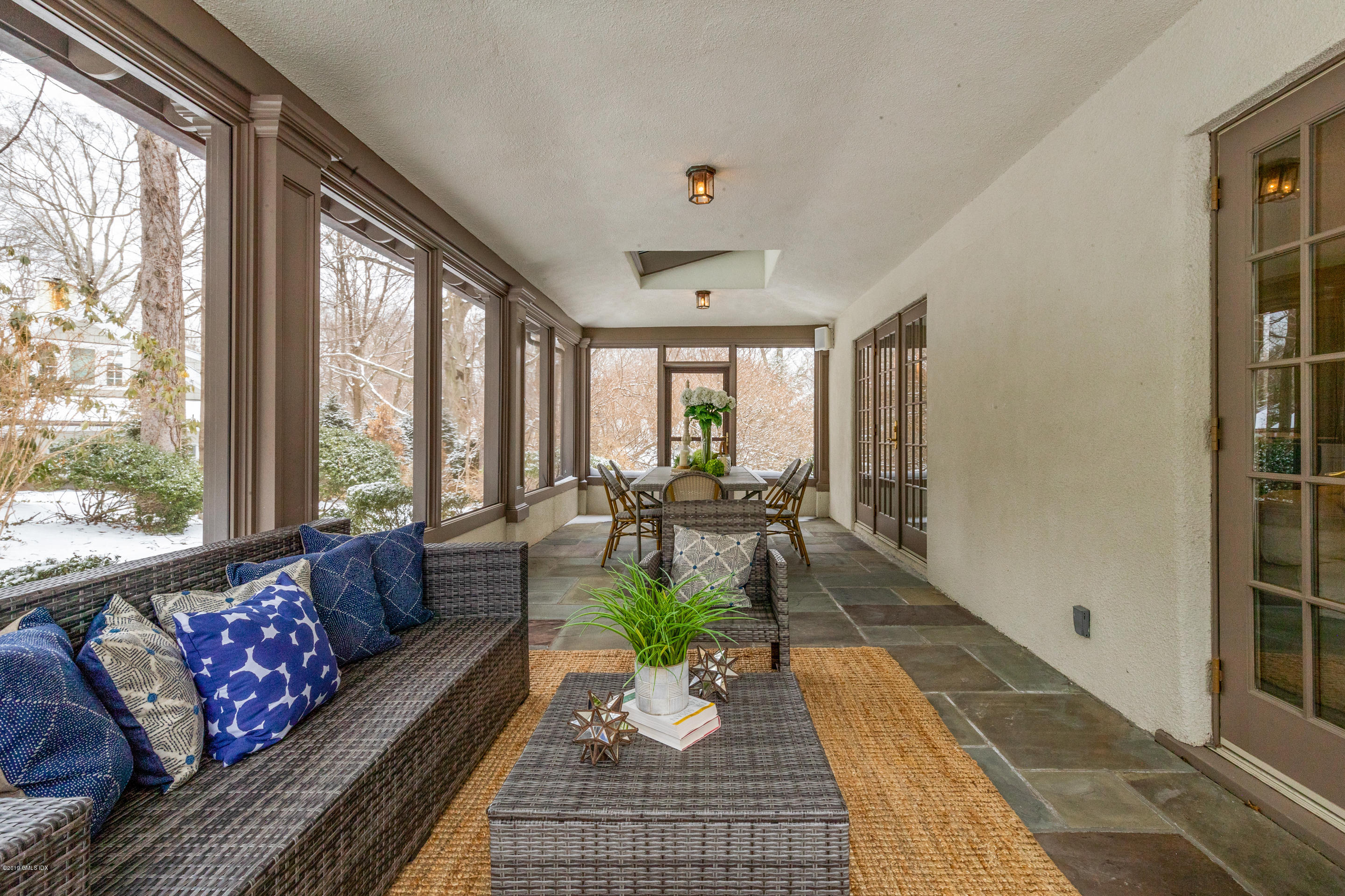 7 Brookside Park Greenwich, CT 06831 - Photo 18 of 52 a living room with furniture large window and a table