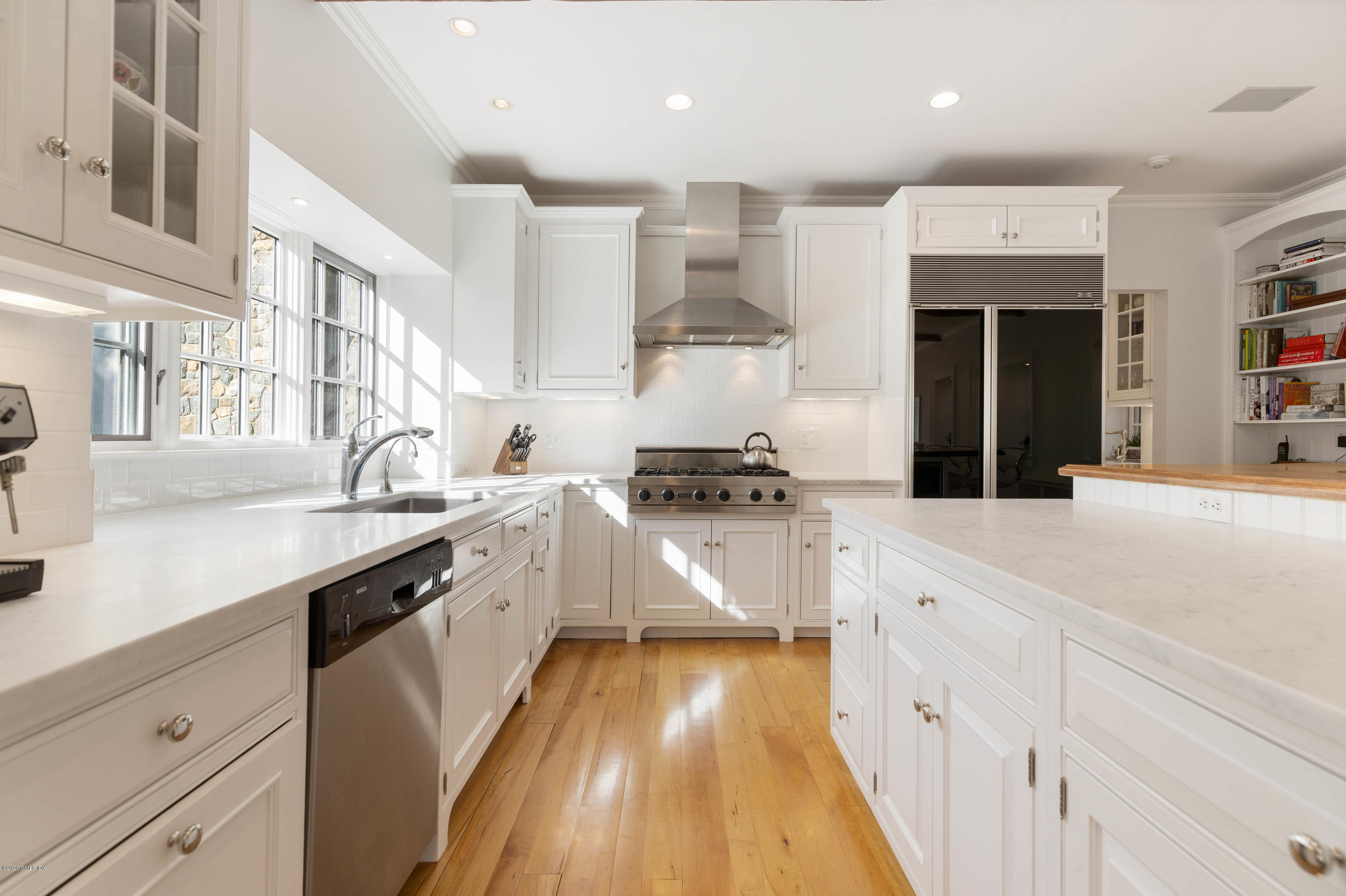 7 Brookside Park Greenwich, CT 06831 - Photo 19 of 52 a large kitchen with stainless steel appliances kitchen island granite countertop a lot of counter space and a sink