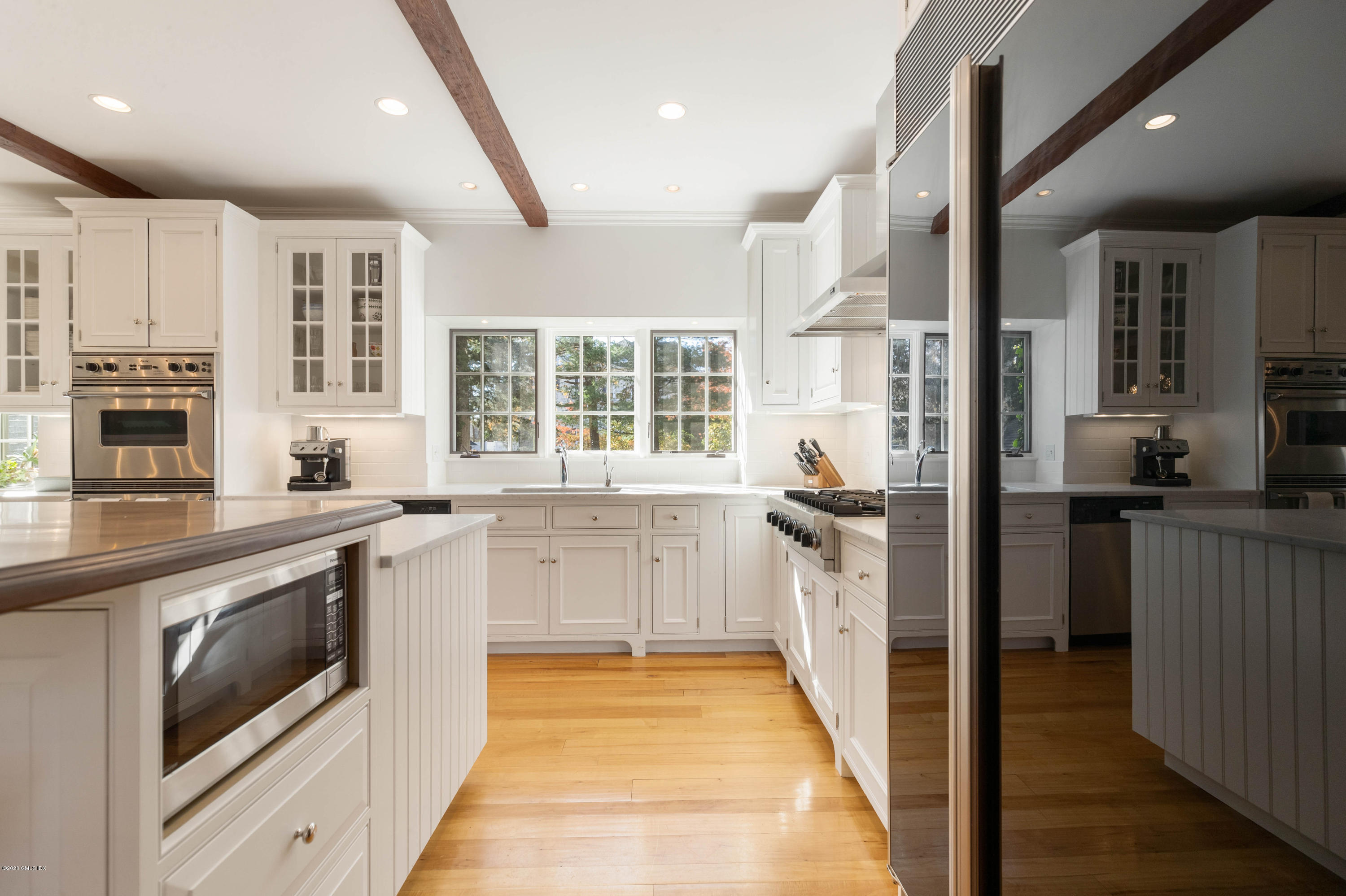 7 Brookside Park Greenwich, CT 06831 - Photo 21 of 52 a kitchen with stainless steel appliances granite countertop a stove and a sink