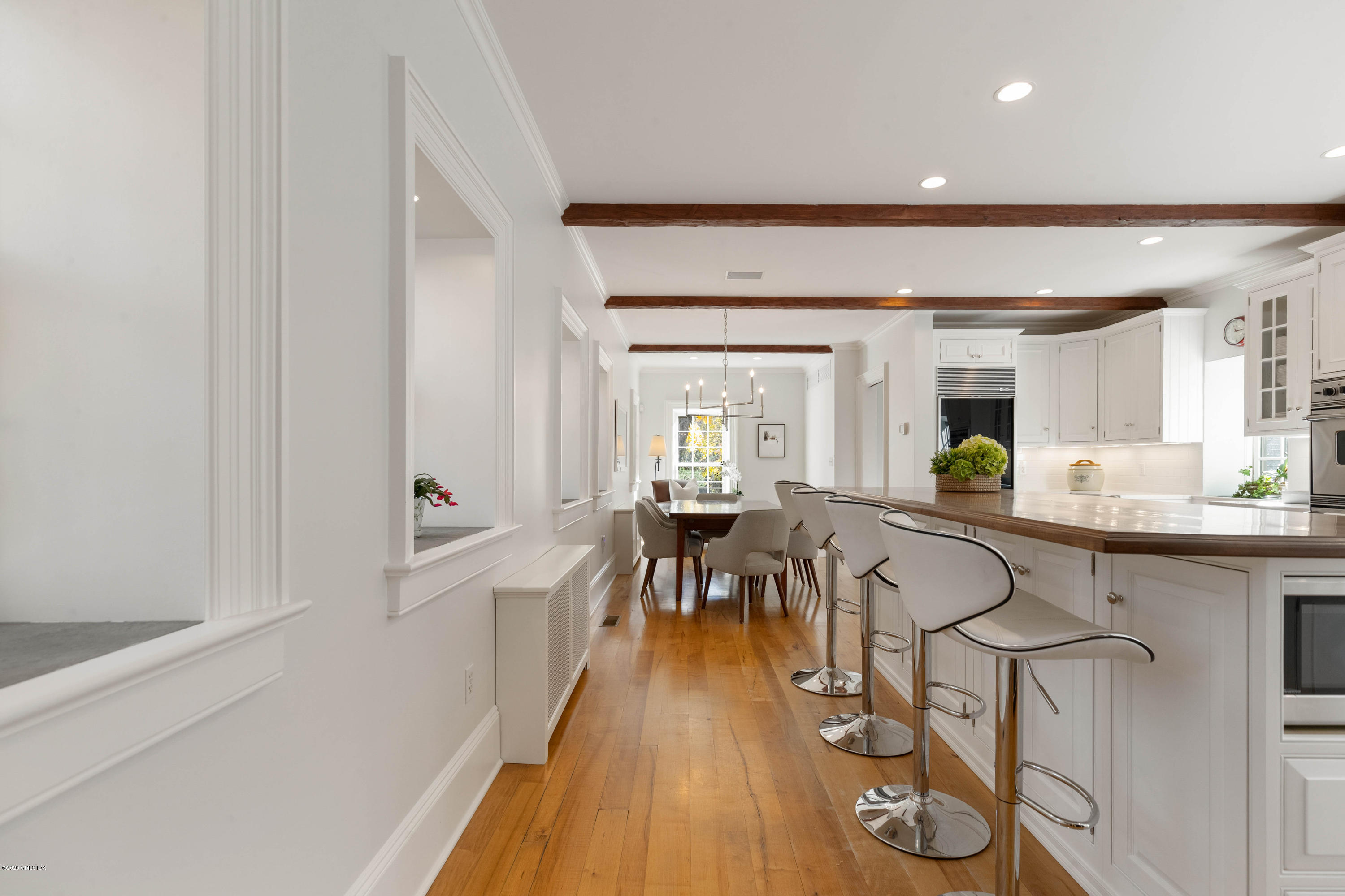7 Brookside Park Greenwich, CT 06831 - Photo 22 of 52 a view of a dining room with furniture and wooden floor