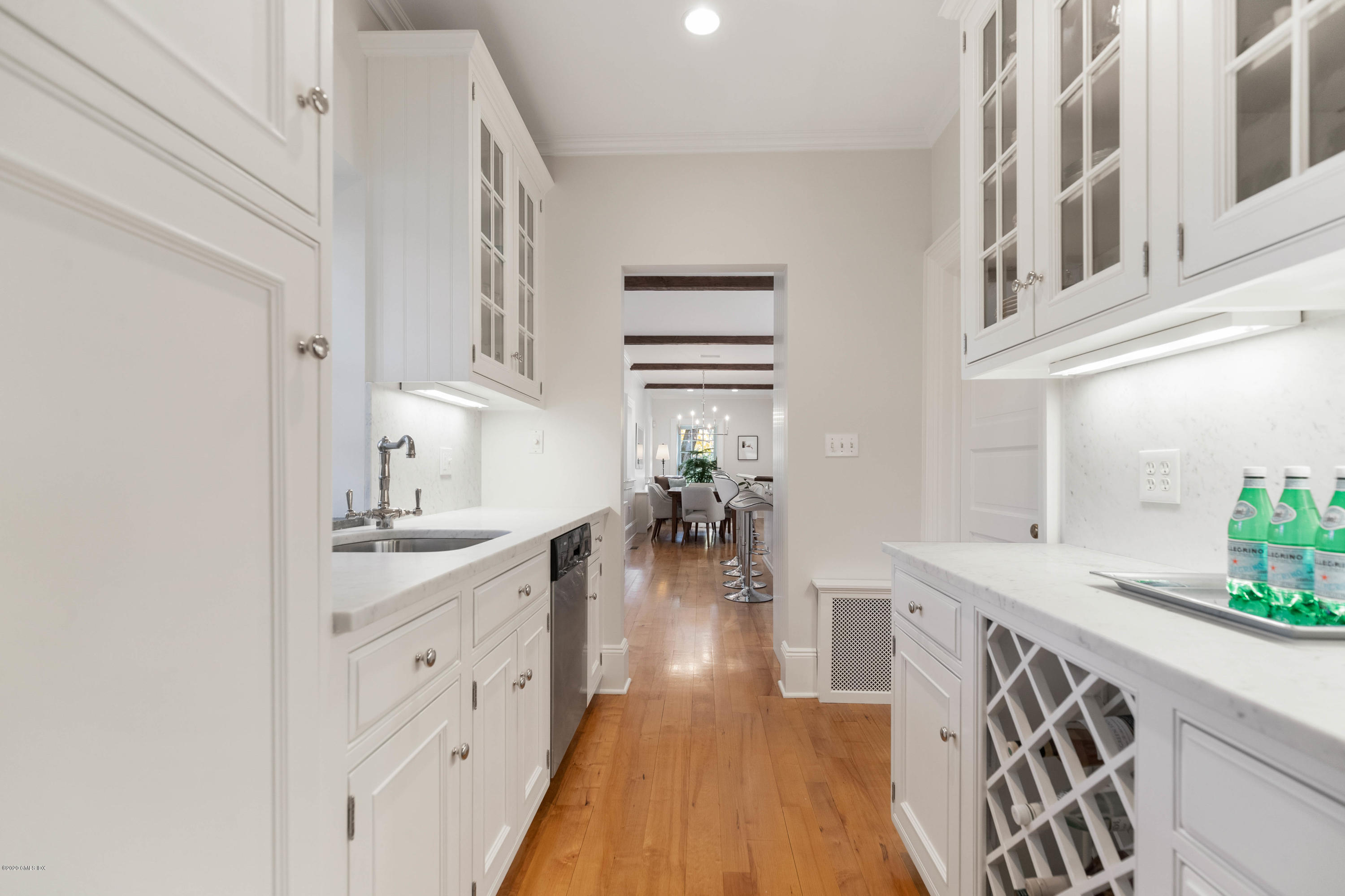 7 Brookside Park Greenwich, CT 06831 - Photo 26 of 52 a kitchen with white cabinets and sink