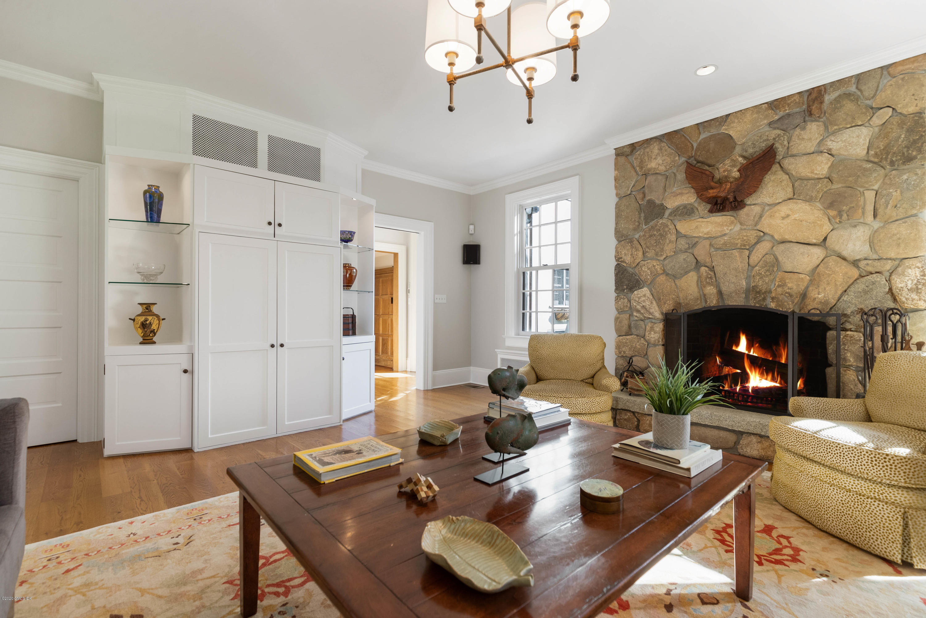 7 Brookside Park Greenwich, CT 06831 - Photo 30 of 52 a living room with furniture and a fireplace