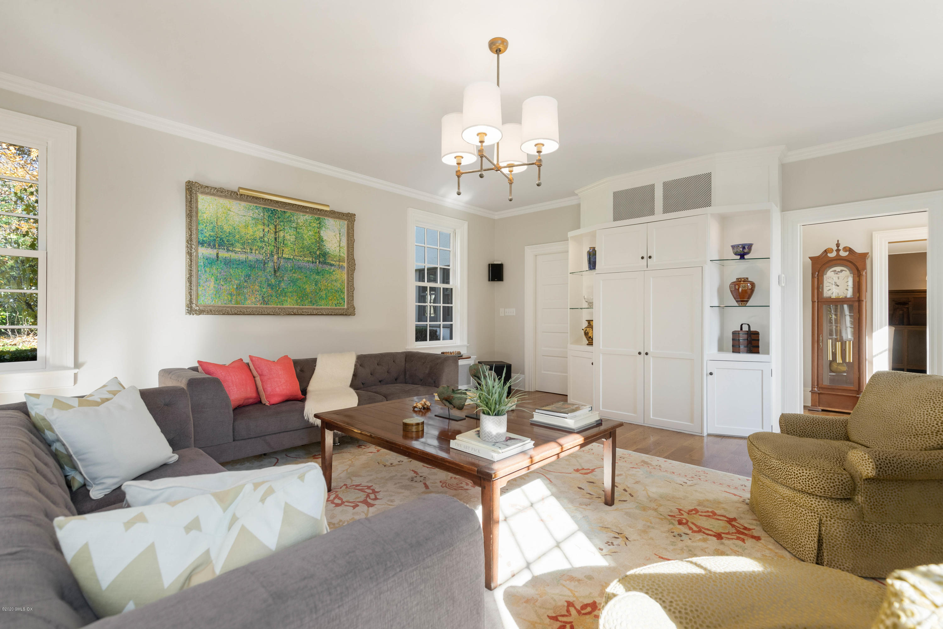 7 Brookside Park Greenwich, CT 06831 - Photo 32 of 52 a living room with furniture and a chandelier