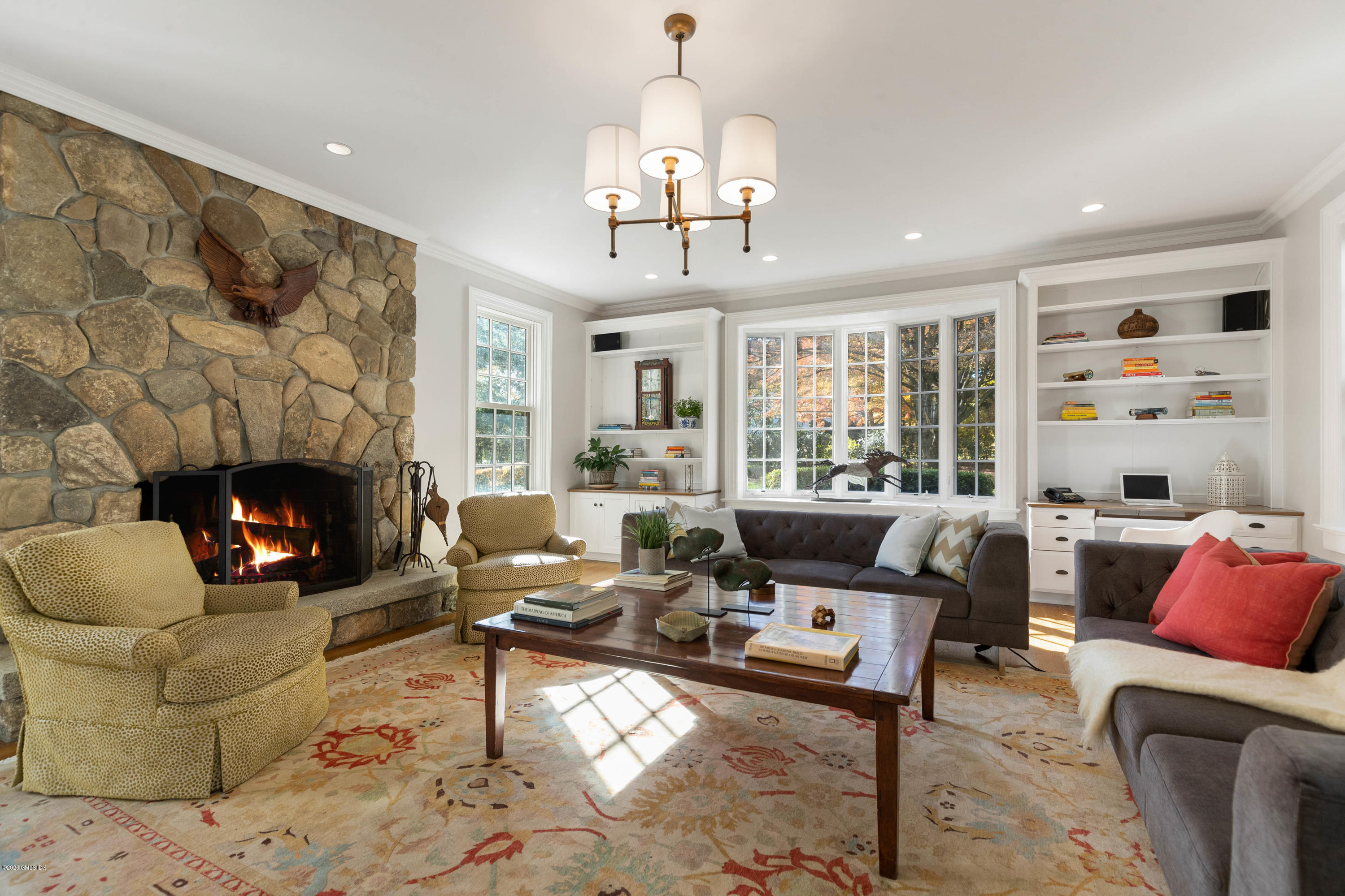 7 Brookside Park Greenwich, CT 06831 - Photo 33 of 52 a living room with furniture fireplace and a large window