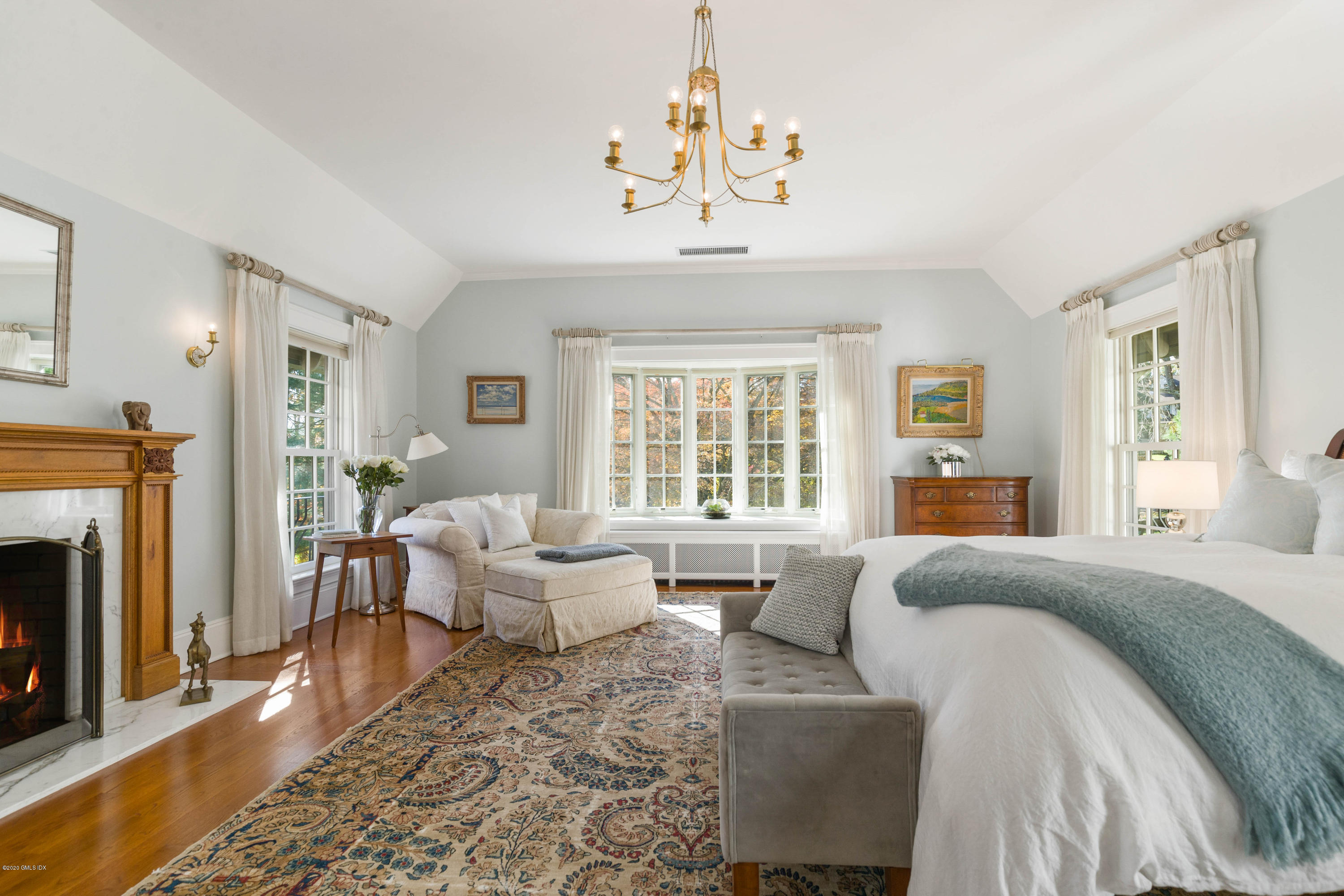 7 Brookside Park Greenwich, CT 06831 - Photo 35 of 52 a spacious bedroom with a bed and a couch