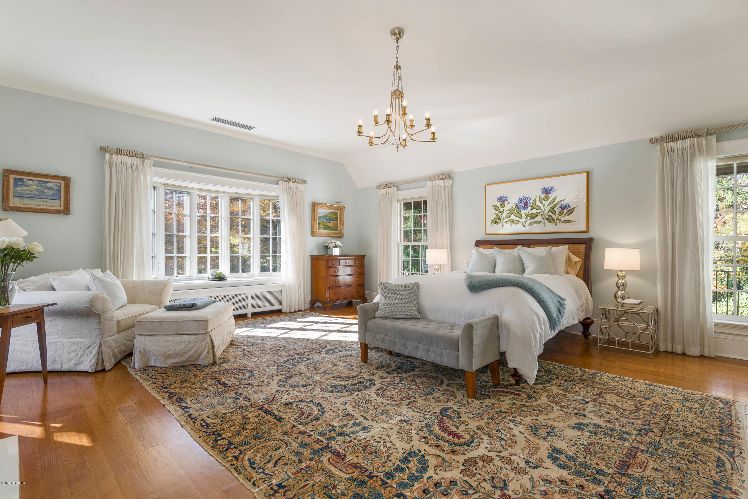 7 Brookside Park Greenwich, CT 06831 - Photo 36 of 52 a bedroom with a bed wooden floor and windows