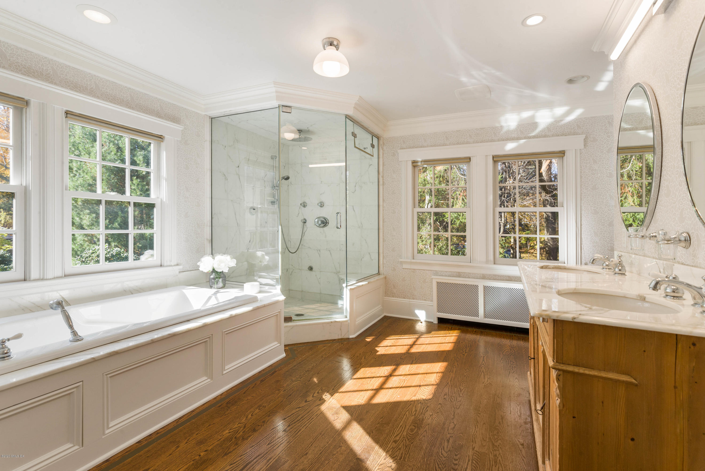 7 Brookside Park Greenwich, CT 06831 - Photo 37 of 52 a bathroom with a tub a sink and a large window