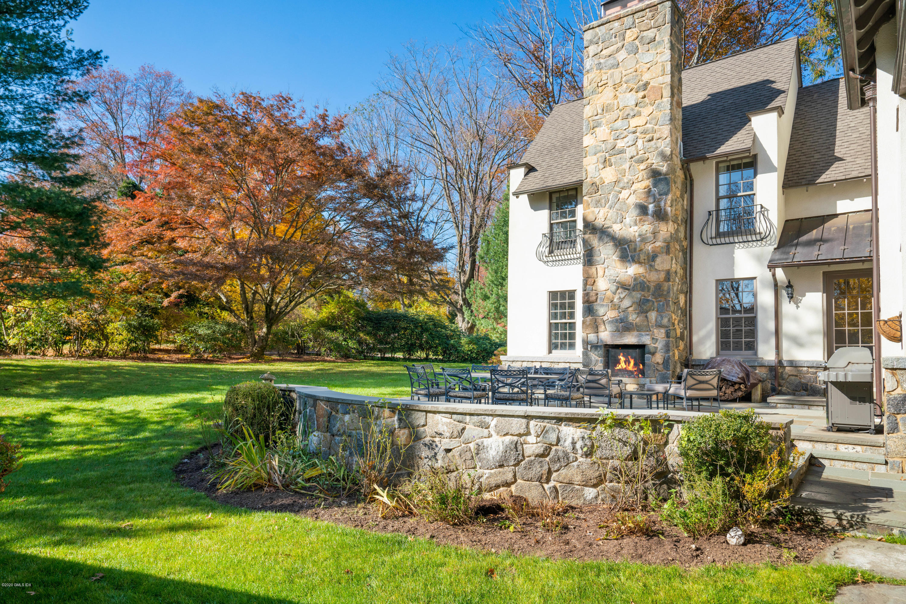 7 Brookside Park Greenwich, CT 06831 - Photo 4 of 52 a view of swimming pool of water with lawn chairs and plants