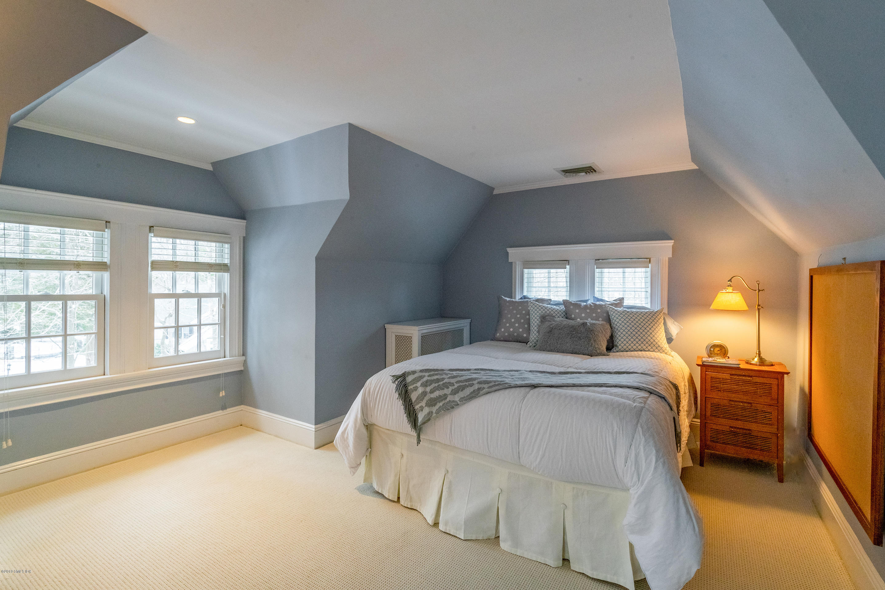 7 Brookside Park Greenwich, CT 06831 - Photo 43 of 52 a bedroom with a bed and wooden floor