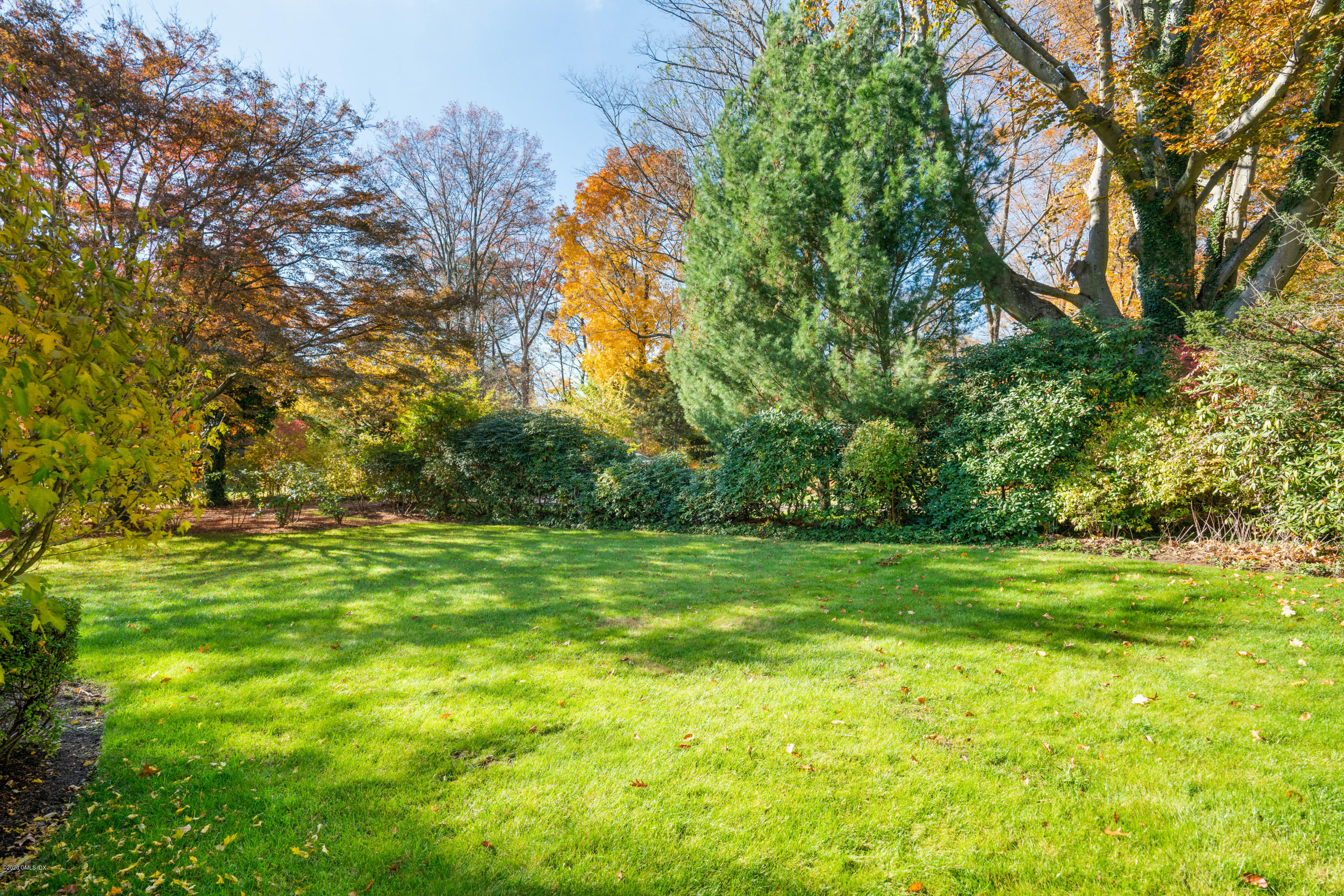 7 Brookside Park Greenwich, CT 06831 - Photo 6 of 52 a yard with trees in the background