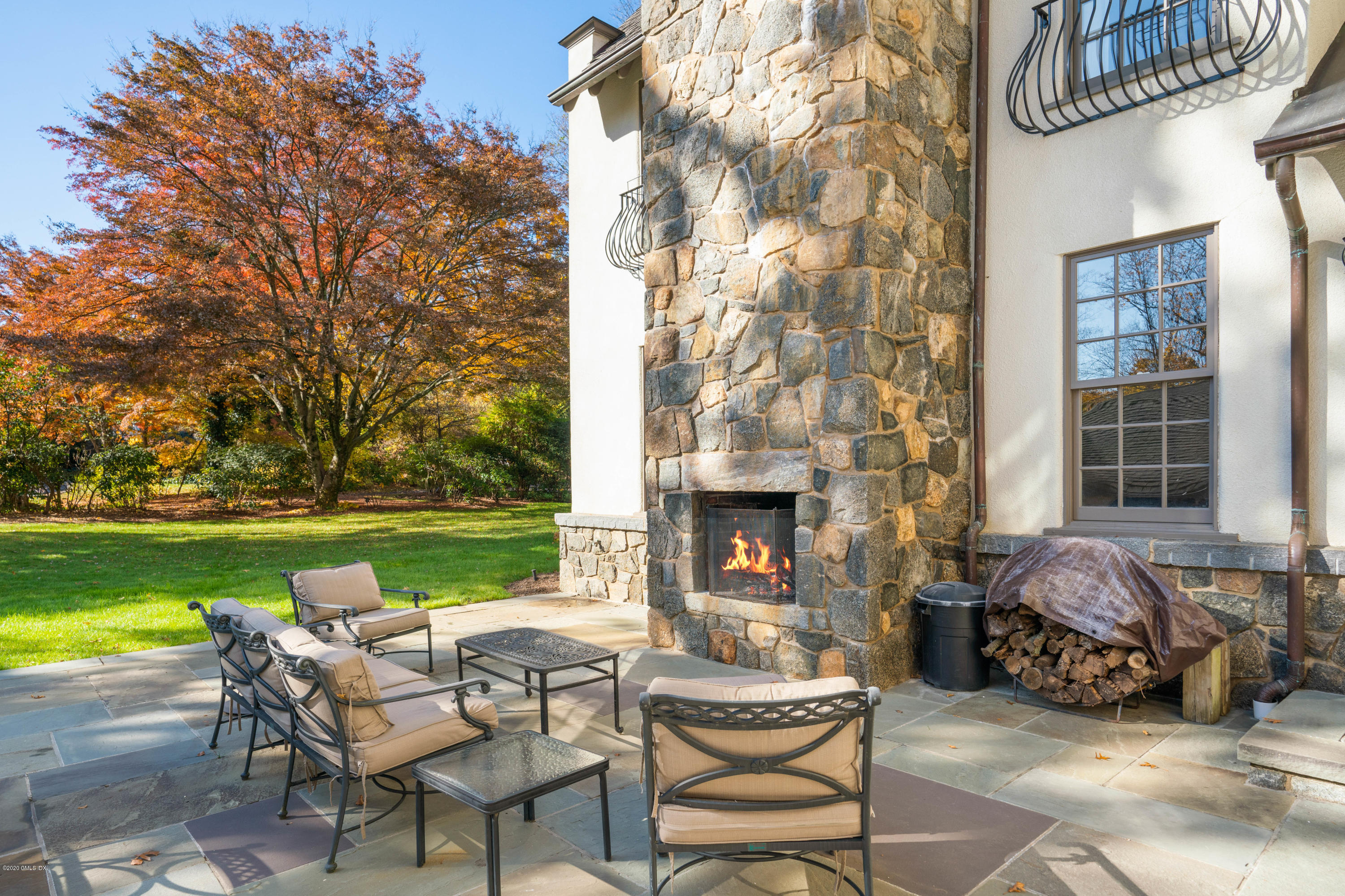 7 Brookside Park Greenwich, CT 06831 - Photo 7 of 52 a balcony with table and chairs