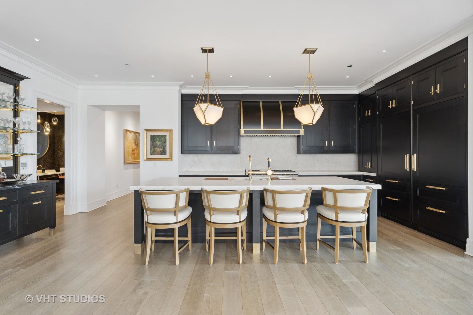 9 West Walton Street, Unit 1901 Chicago, IL 60610 - Photo 11 of 64 a dining area with a table chairs and wooden floor