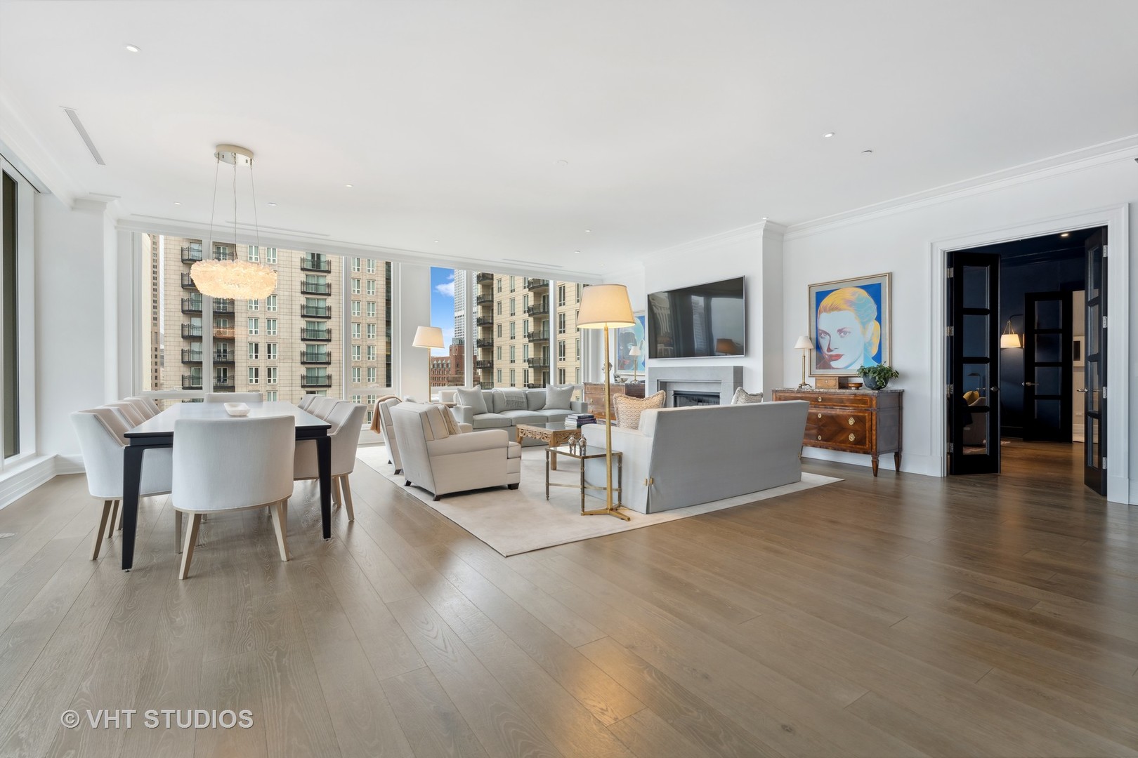9 West Walton Street, Unit 1901 Chicago, IL 60610 - Photo 18 of 64 a view of a dining room with furniture and wooden floor