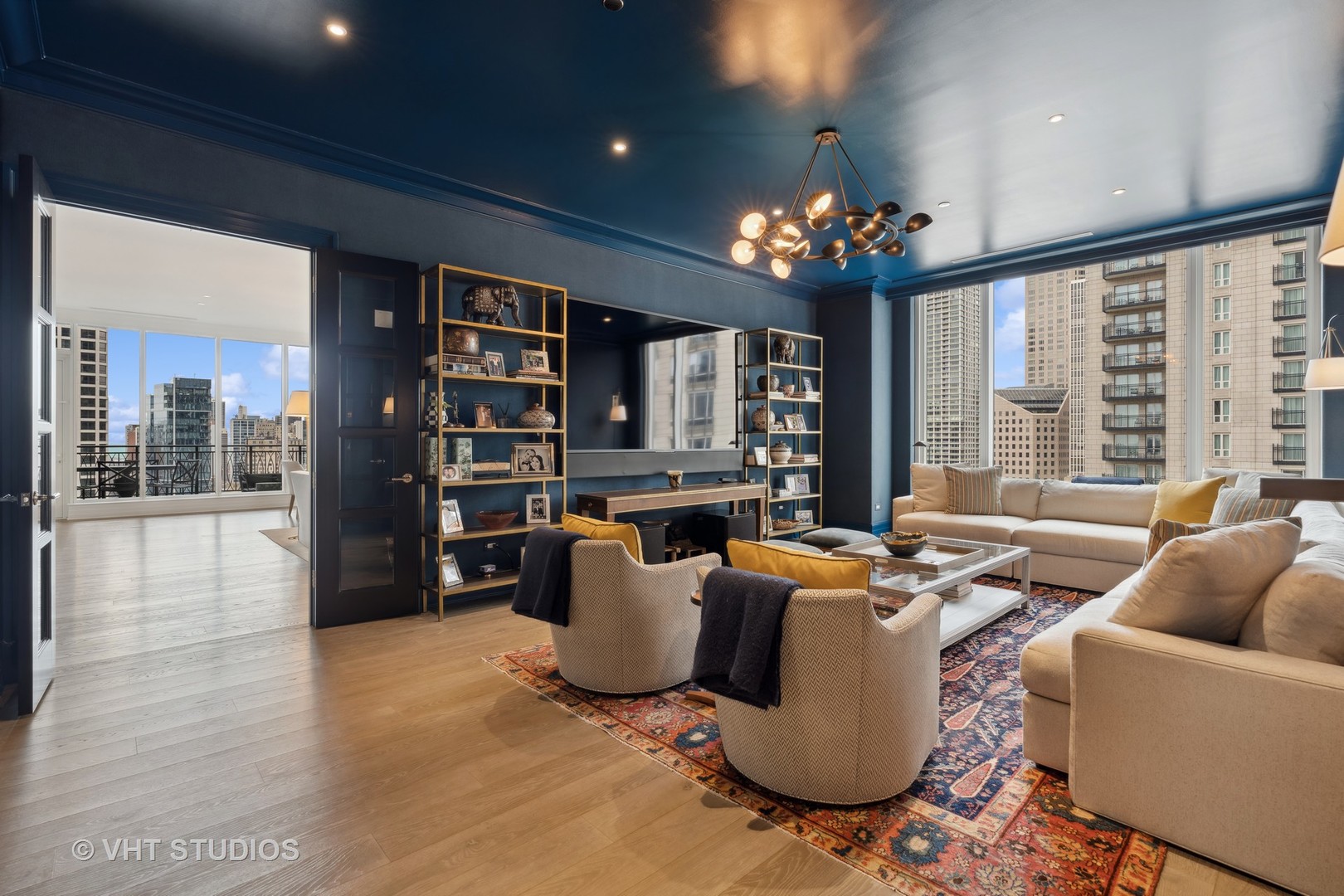 9 West Walton Street, Unit 1901 Chicago, IL 60610 - Photo 21 of 64 a living room with furniture a large window and bookshelf