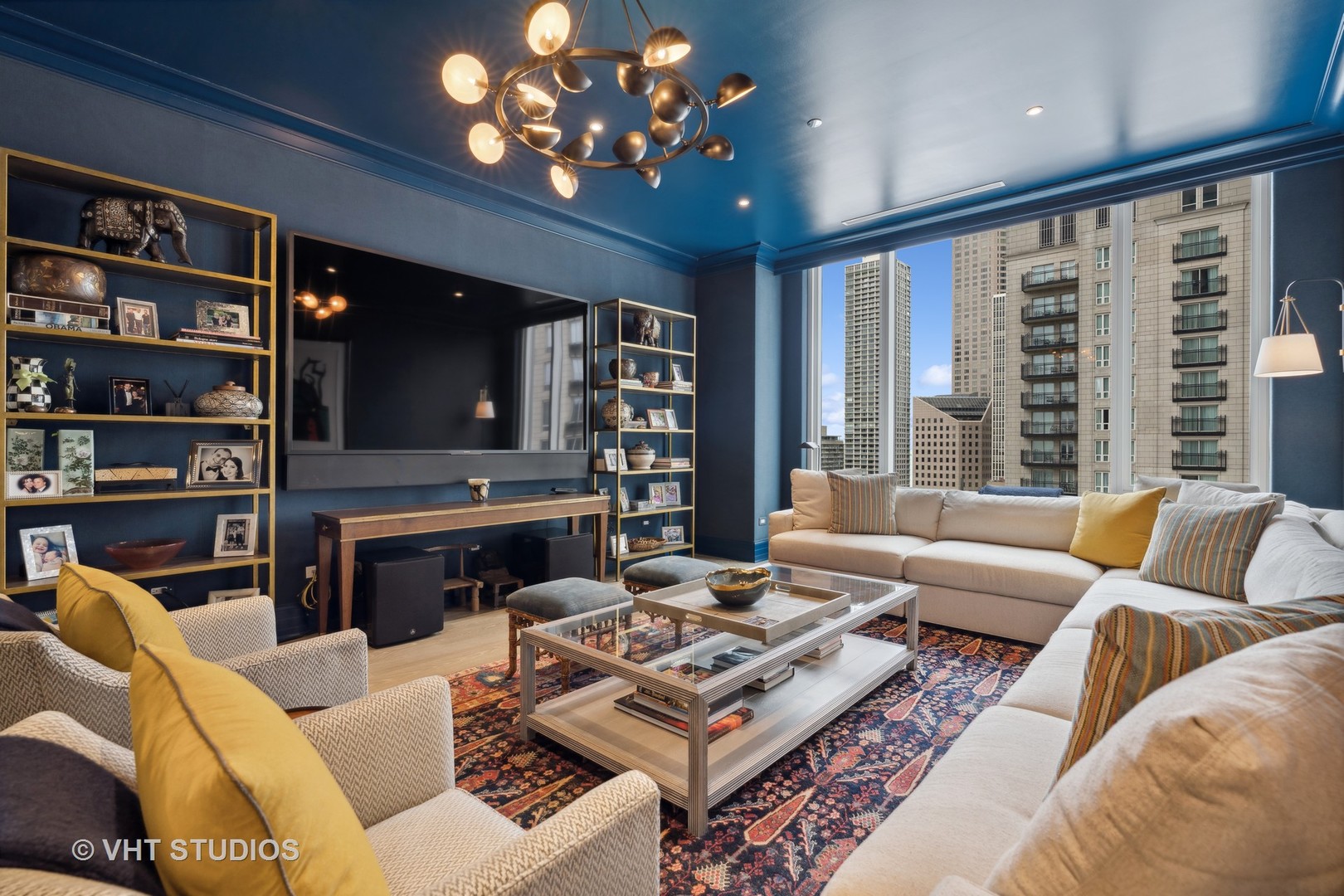 9 West Walton Street, Unit 1901 Chicago, IL 60610 - Photo 22 of 64 a living room with furniture a large window and a flat screen tv
