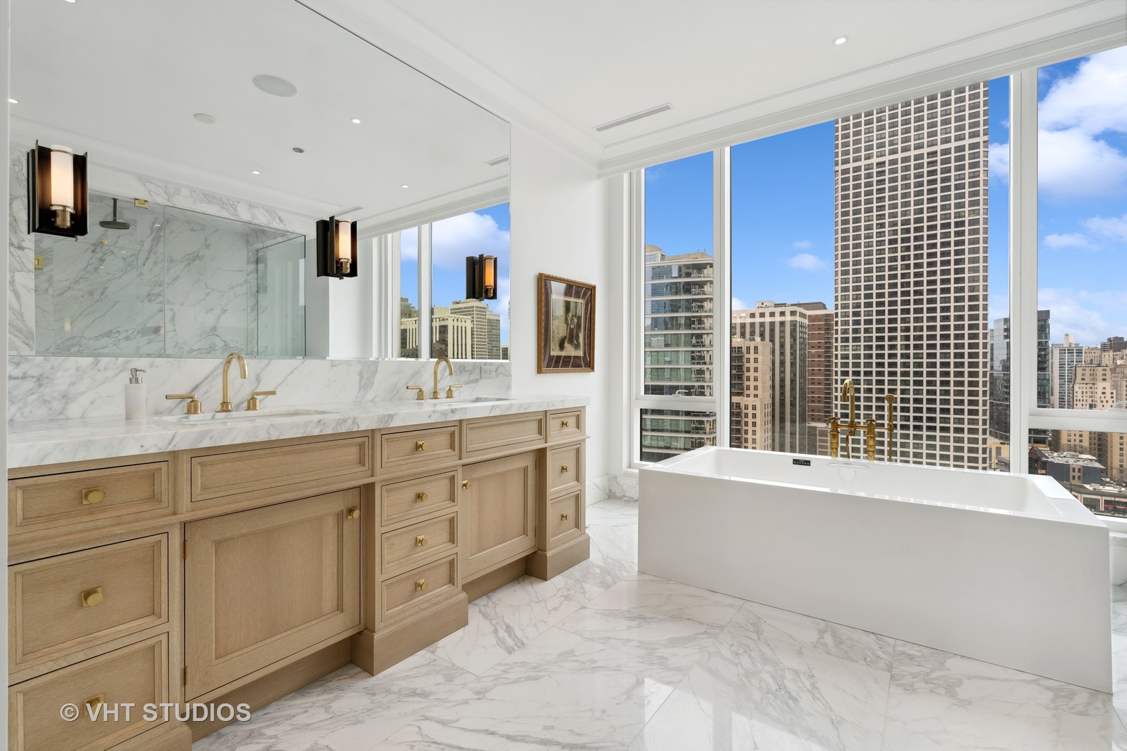 9 West Walton Street, Unit 1901 Chicago, IL 60610 - Photo 32 of 64 a spacious bathroom with sinks mirror and a bathtub