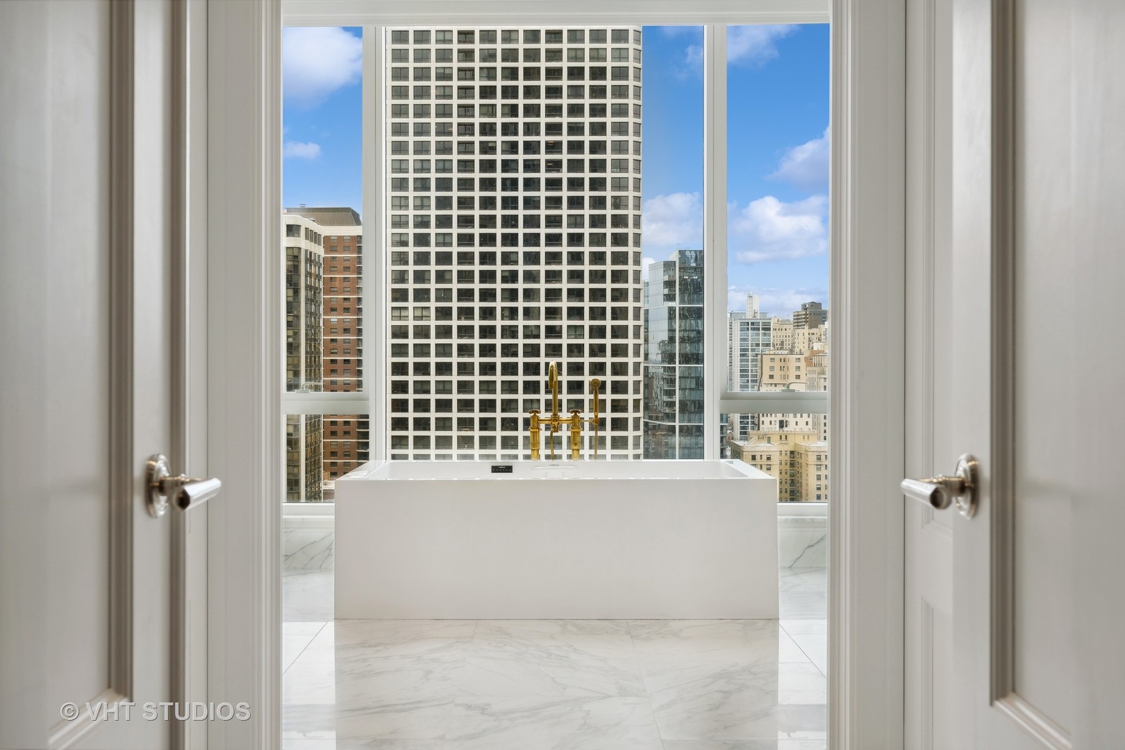 9 West Walton Street, Unit 1901 Chicago, IL 60610 - Photo 36 of 64 a bathroom with a bathtub and shower