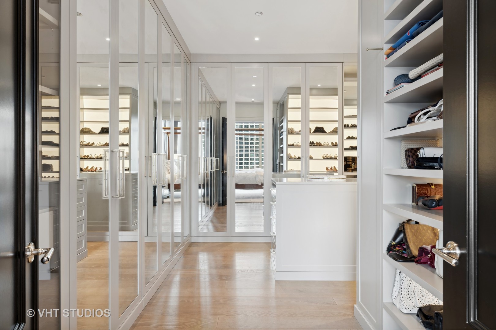 9 West Walton Street, Unit 1901 Chicago, IL 60610 - Photo 37 of 64 a view of a livingroom with shelves