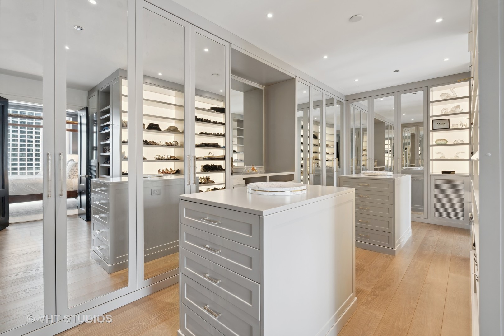 9 West Walton Street, Unit 1901 Chicago, IL 60610 - Photo 39 of 64 a bathroom with a double vanity sink and glass door