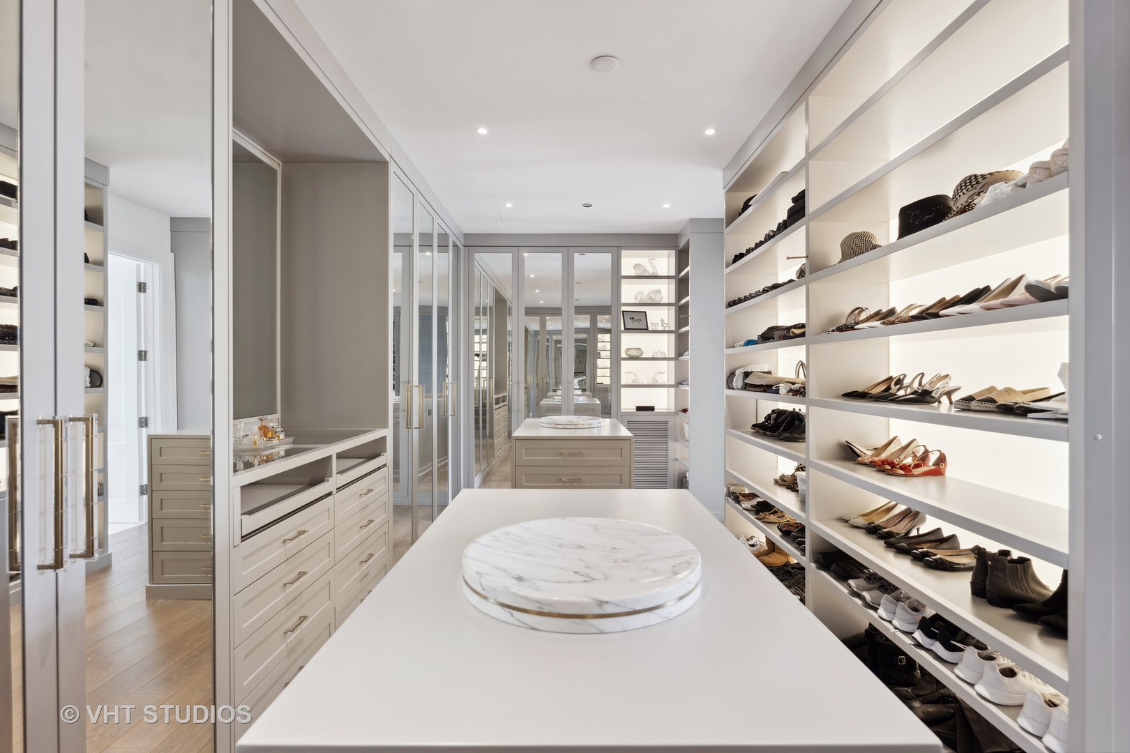9 West Walton Street, Unit 1901 Chicago, IL 60610 - Photo 40 of 64 a kitchen with stainless steel appliances a stove a sink and a refrigerator with wooden floor