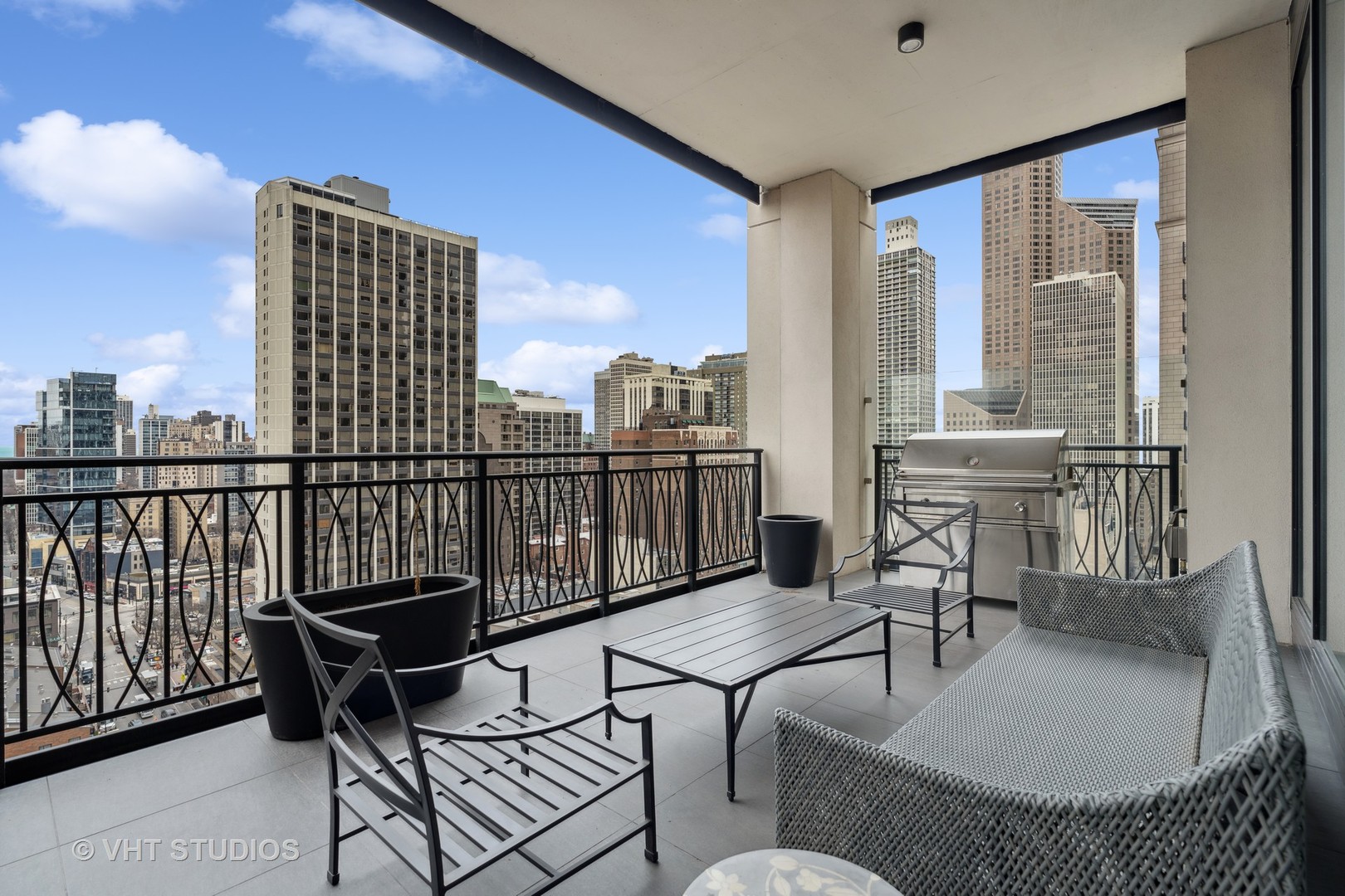 9 West Walton Street, Unit 1901 Chicago, IL 60610 - Photo 49 of 64 a living room with furniture and a floor to ceiling window