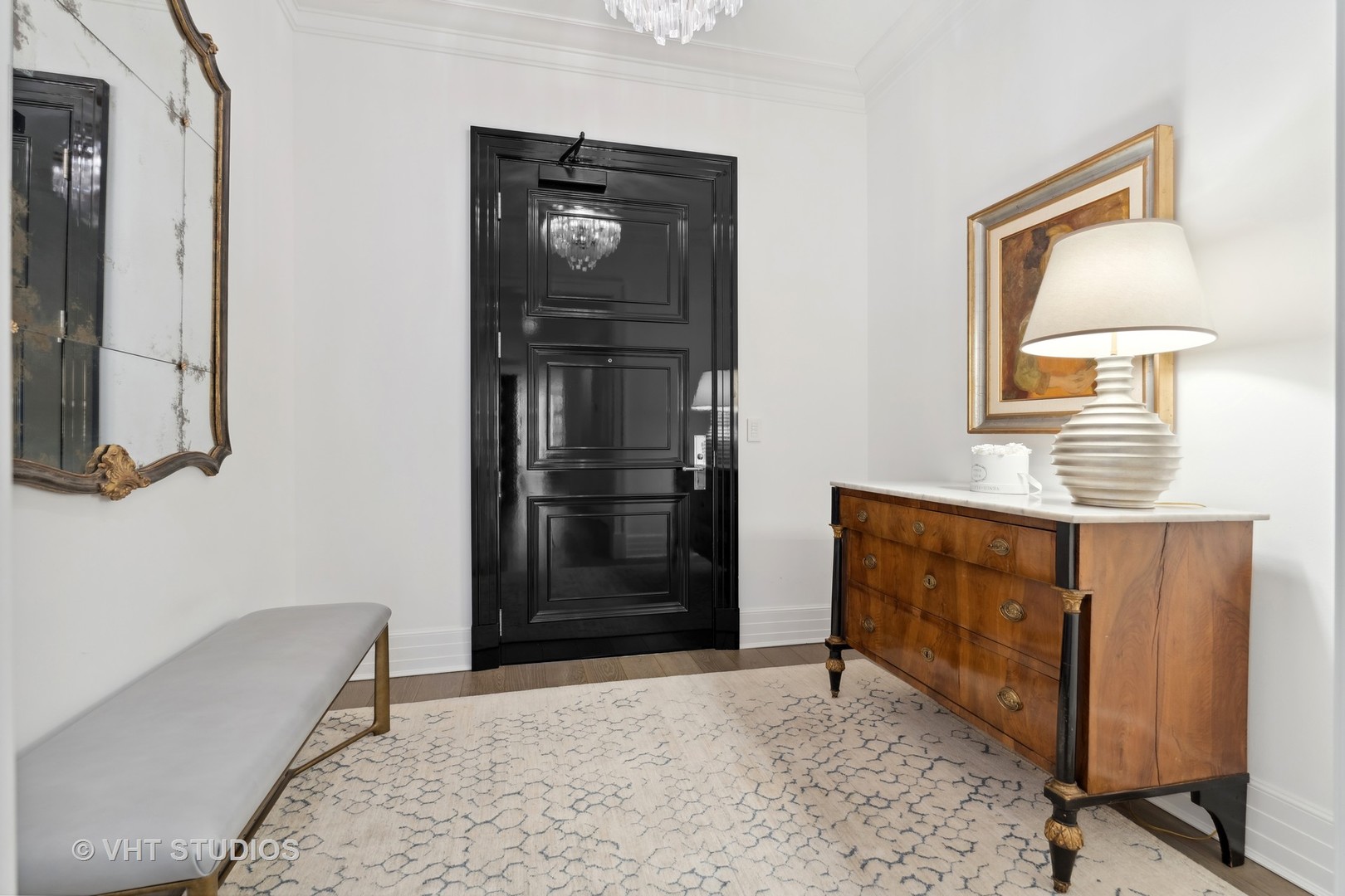9 West Walton Street, Unit 1901 Chicago, IL 60610 - Photo 5 of 64 a view of an entryway with table and mirror