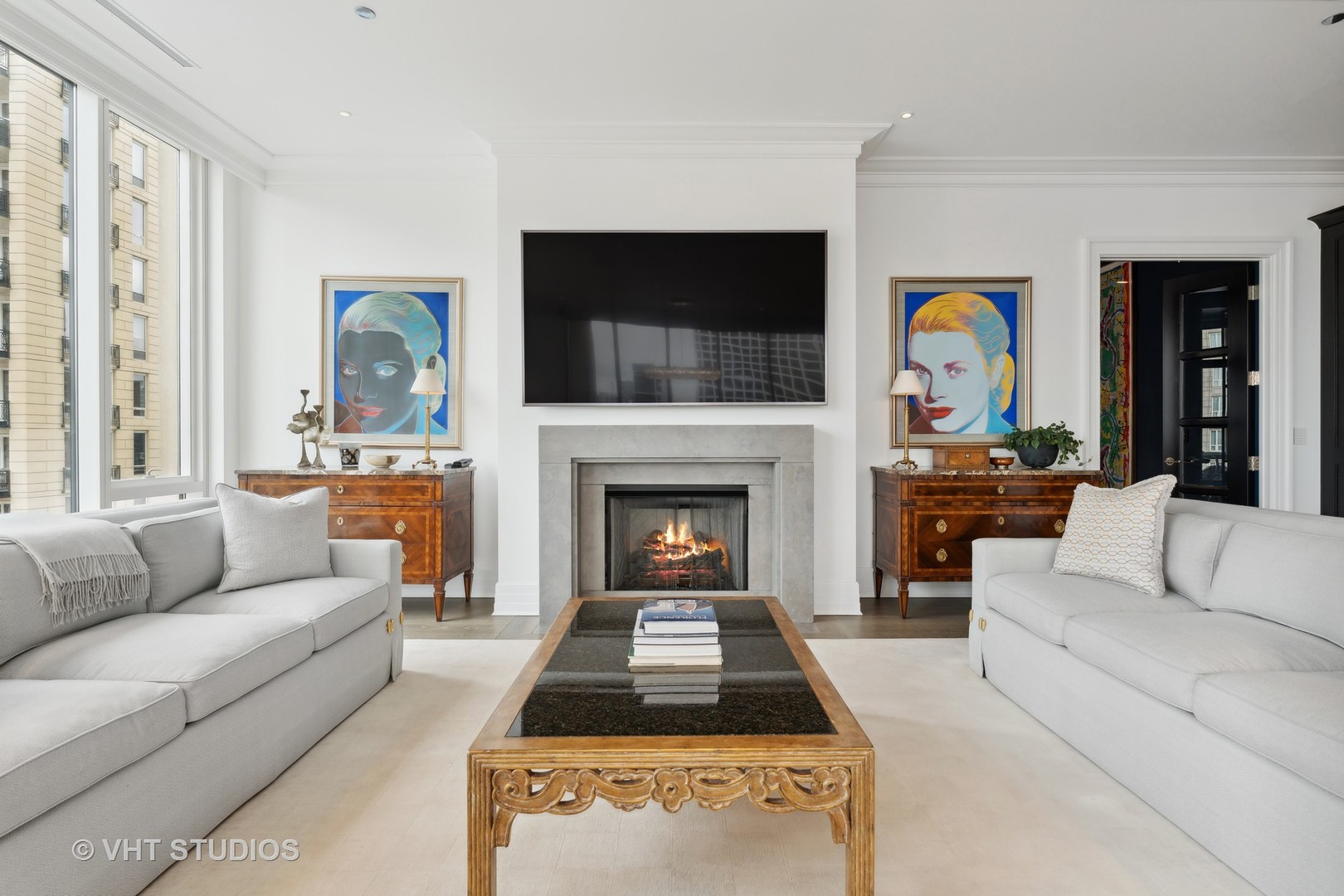 9 West Walton Street, Unit 1901 Chicago, IL 60610 - Photo 7 of 64 a living room with furniture a flat screen tv and a fireplace