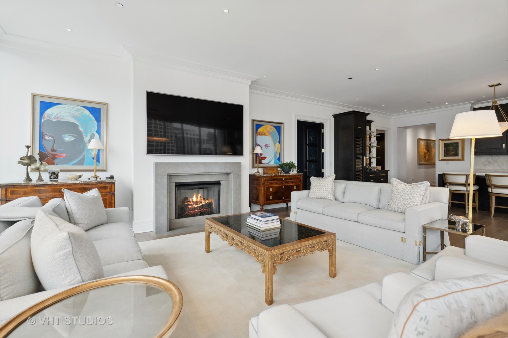 9 West Walton Street, Unit 1901 Chicago, IL 60610 - Photo 8 of 64 a living room with furniture a flat screen tv and a fireplace