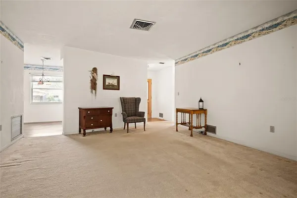 a view of a livingroom with furniture and a fireplace