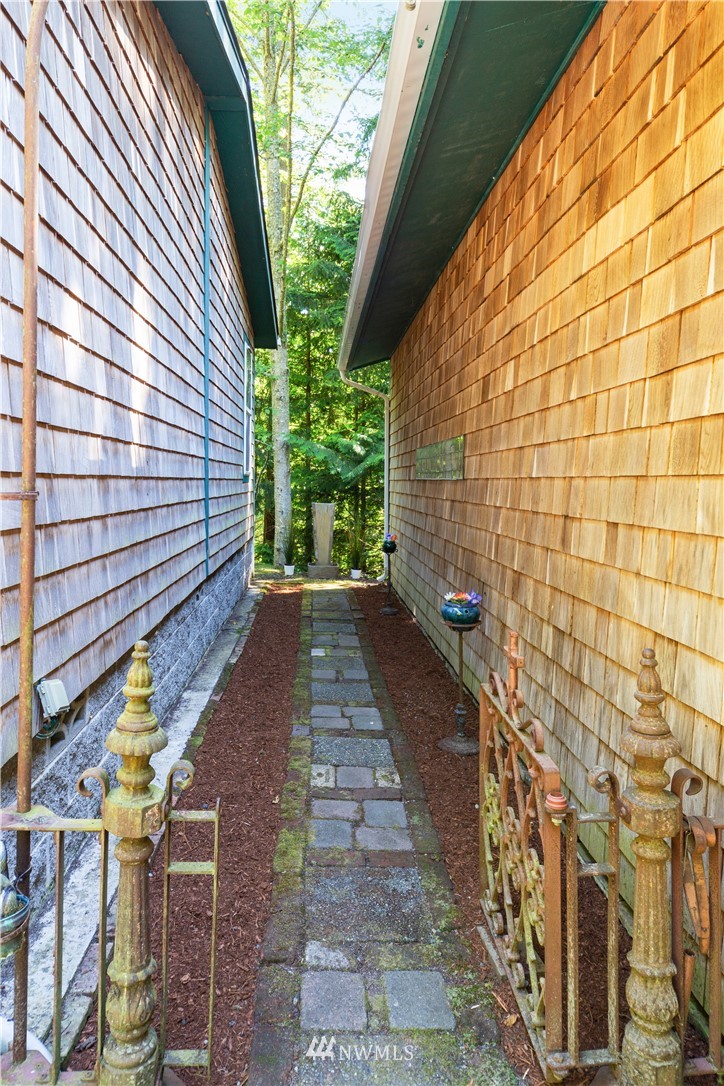7054 Beaver Valley Road Port Hadlock, WA 98339 - Photo 3 of 40 a view of a pathway with a backyard