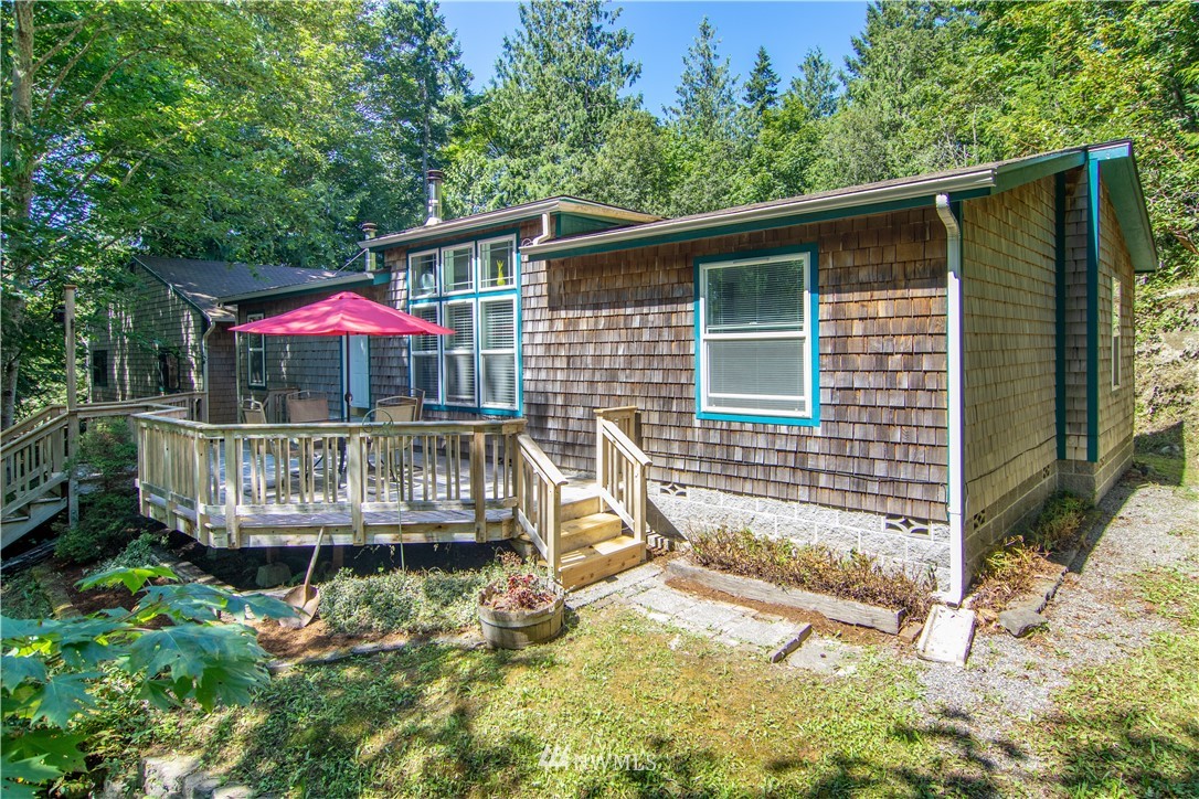 7054 Beaver Valley Road Port Hadlock, WA 98339 - Photo 5 of 40 an outdoor view of a house with balcony