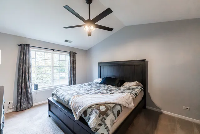 a bedroom with a bed and a walk in closet