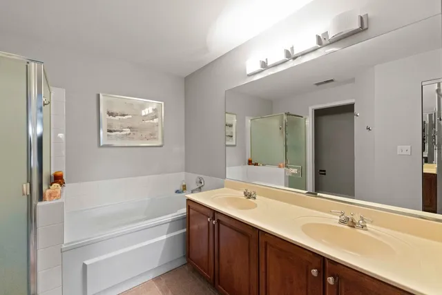 a bathroom with a bathtub and a shower