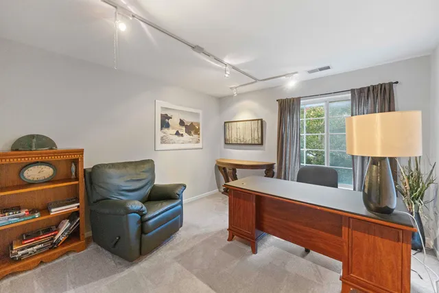 a livingroom with furniture and wooden floor