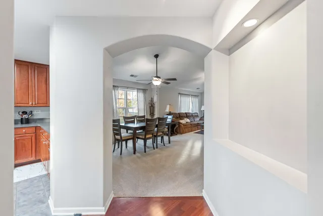 a view of a dining room with furniture and chandelier